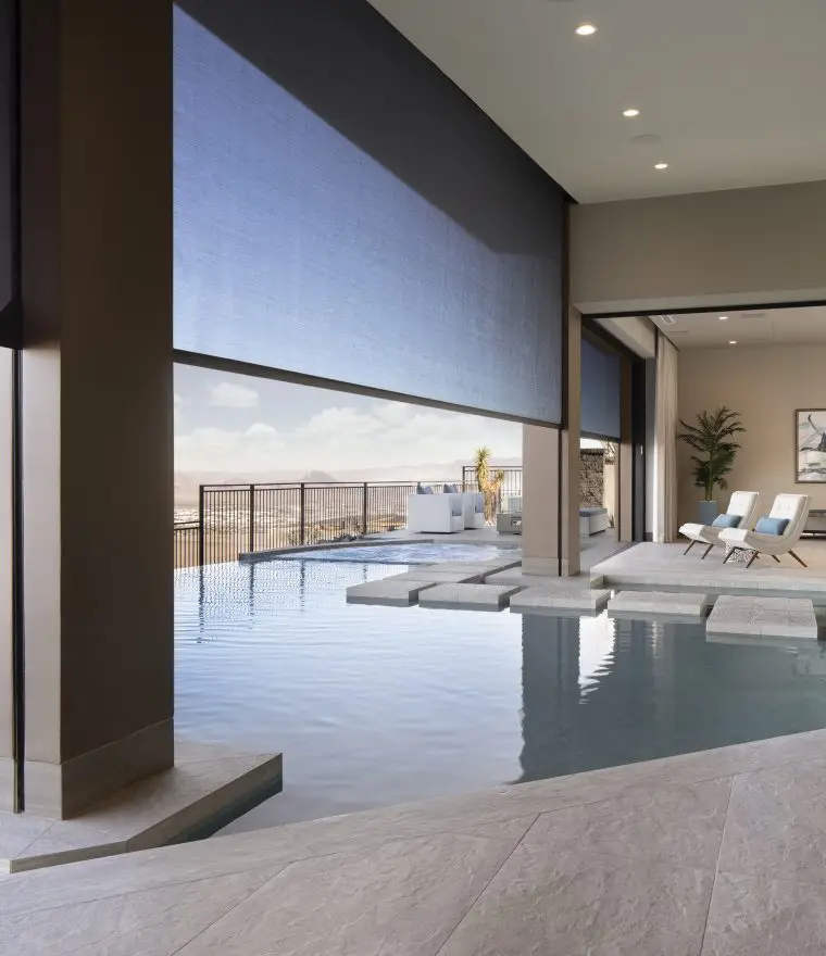 a pool in a house, motorized retractable patio screens
